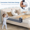 Foldable bed rail in gray with a child using the convenient swing-down design for easy access in and out of bed.