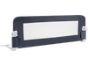 Foldable gray bed rail with soft padding, adjustable strap, and T-shaped legs for toddler safety and stability.
