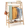 Bamboo clothing rack with hanging rod, 2-tier shelves, and side hooks for versatile storage in natural finish.