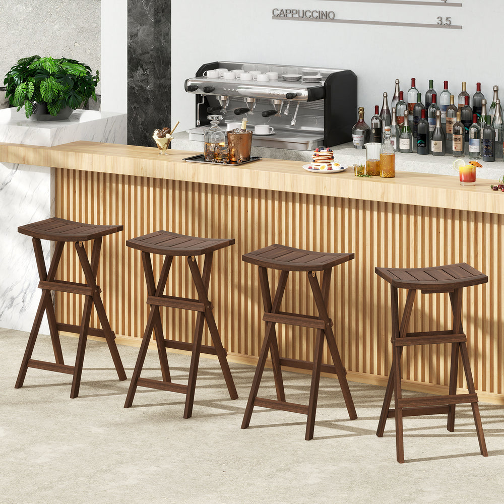 Set of two teak wood bar stools with saddle seats and footrests, perfect for kitchen islands or balconies.