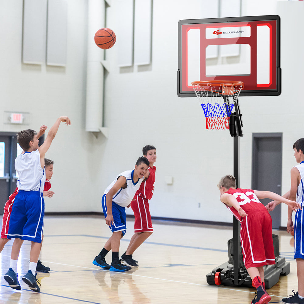 Young players practicing basketball with an adjustable height hoop, showcasing its versatility for indoor and outdoor.