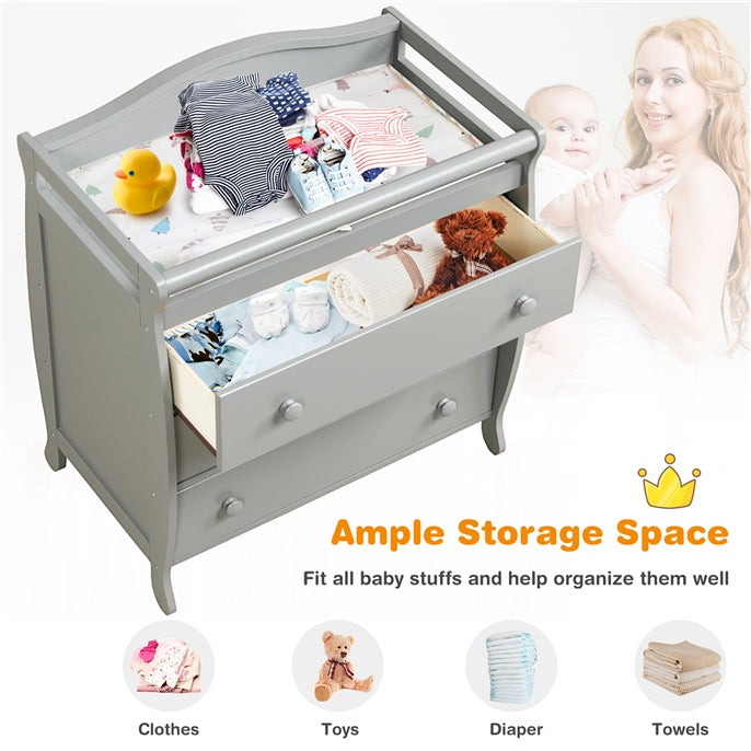 Gray baby changing table with three drawers, safety belt, and ample storage for diapers and baby products.