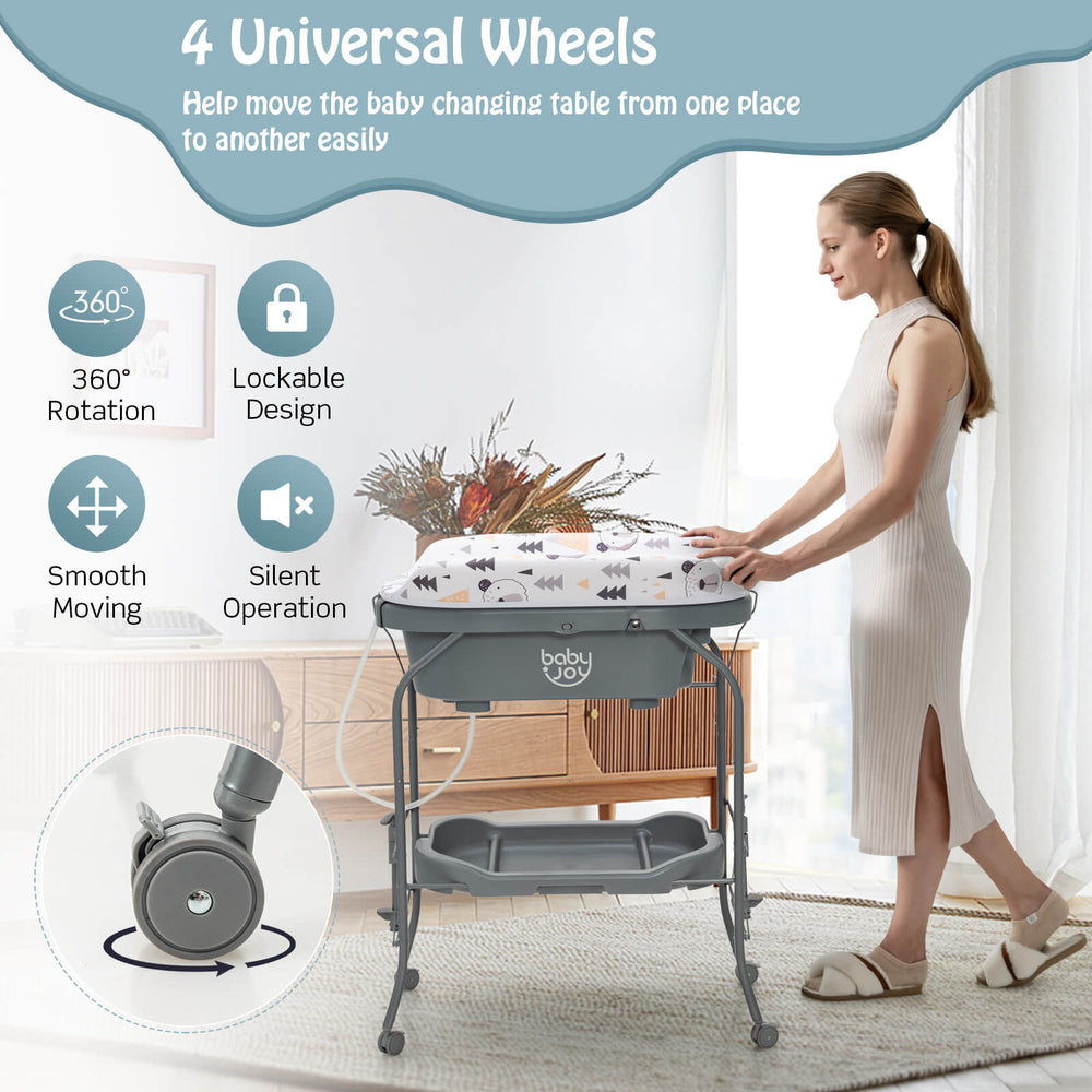 Portable baby changing table in gray with 4 lockable wheels, storage basket, and adjustable height for convenience.