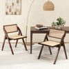 Brown foldable dining chair with woven rattan backrest, sturdy rubber wood frame, perfect for stylish and space-saving.