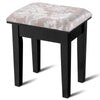 Black vanity stool with elegant patterned cushion, designed for comfort and style in a dressing table set.