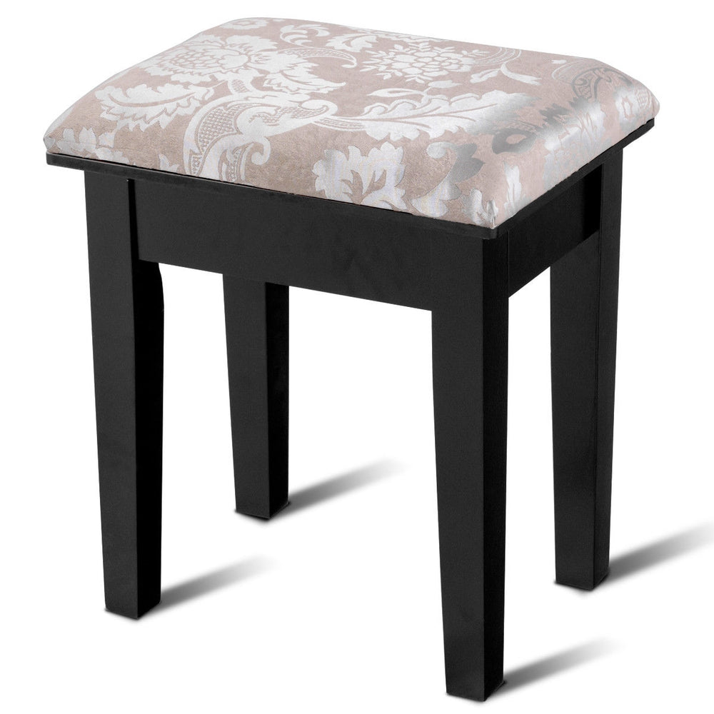 Black vanity stool with elegant patterned cushion, designed for comfort and style in a dressing table set.
