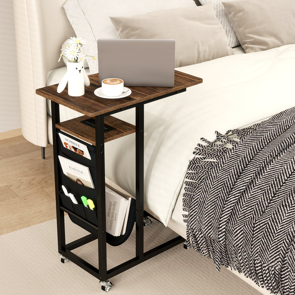 C-shaped end table with rustic wood grain, built-in charging station, and retractable tabletop for bedside convenience.