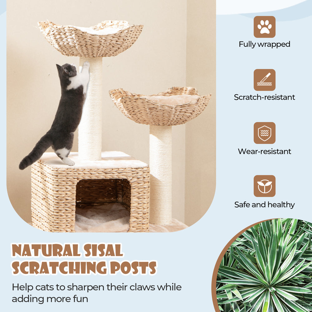 48-inch beige cat tower featuring natural sisal scratching posts, top perch, and side bed for climbing and napping.