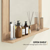 Rectangle bathroom mirror with a brown wood frame and open shelf for extra storage space, ideal for wall mounting.