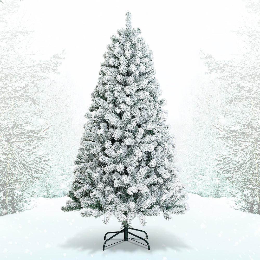 Snow-flocked 6 feet artificial Christmas tree with 600 branch tips and a sturdy metal stand, perfect for festive decor.
