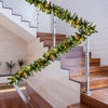 9FT pre-lit artificial Christmas garland with red berries and LED lights, perfect for festive indoor or outdoor.