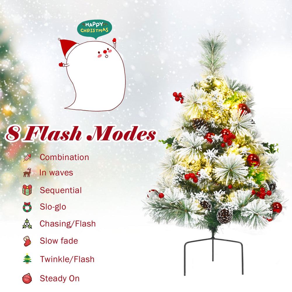 Pre-lit 2 feet flocked Christmas tree with 30 warm LED lights, 8 flash modes, and decorative pine cones and berries.