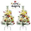 Set of 2 pre-lit 2-foot Christmas trees with flocked leaves, red ornaments, and warm LED lights for festive decoration.