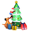 Close-up of the inflatable Santa climbing the Christmas tree, with colorful decorations and LED lights for a festive.