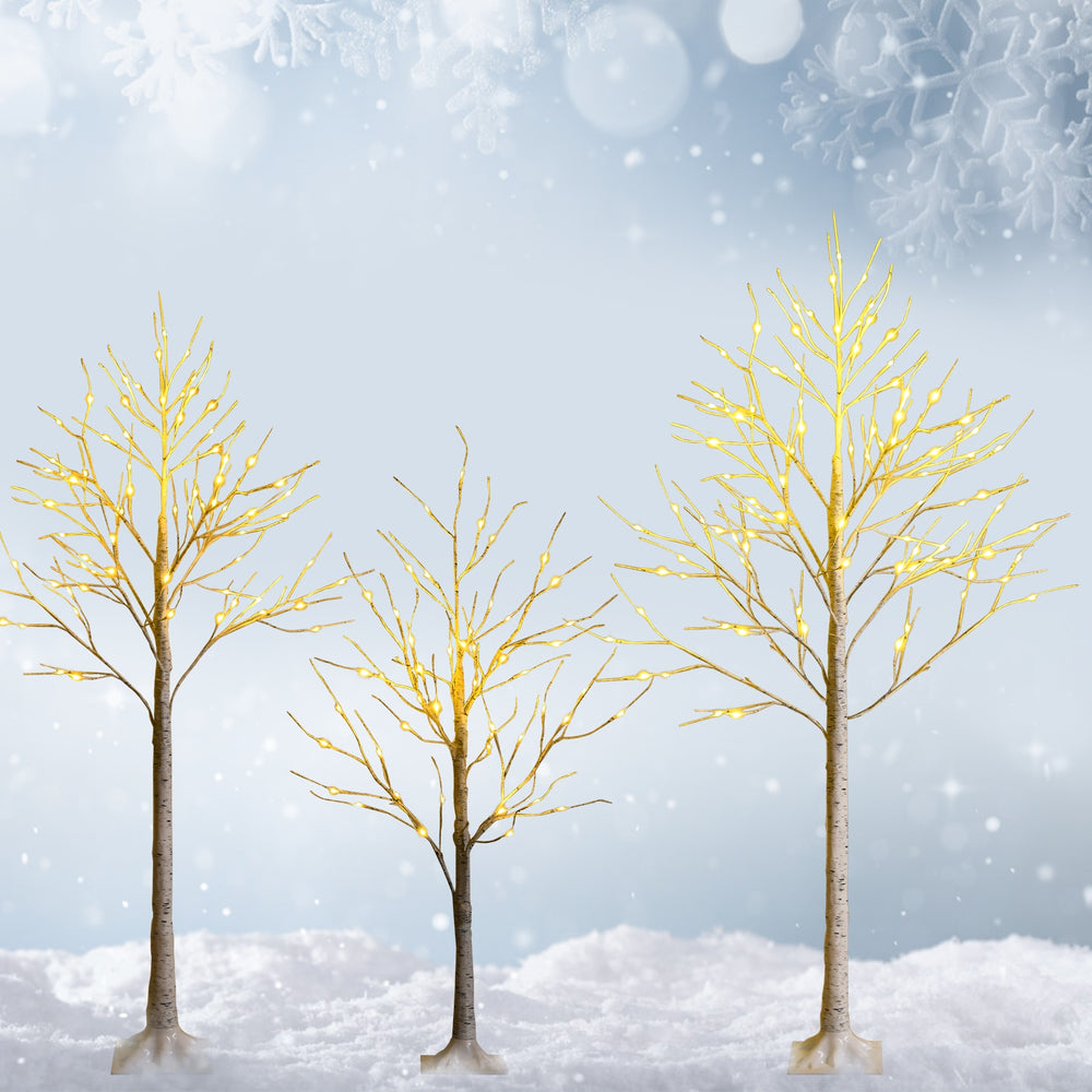 Three pre-lit white twig birch trees with 48 LED lights, perfect for festive indoor holiday decoration.
