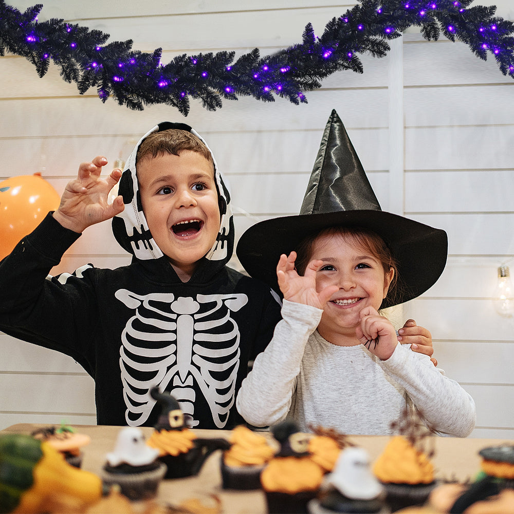 Flexible 9-foot pre-lit Halloween garland with 50 purple LED lights, ideal for unique decorations and adding a spooky.
