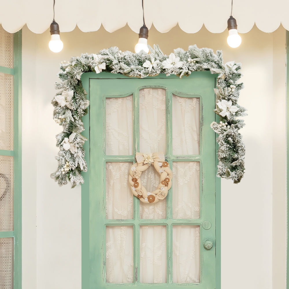9-foot pre-lit artificial Christmas garland with 50 LED lights, featuring snow flocking, white flowers, and berries for.