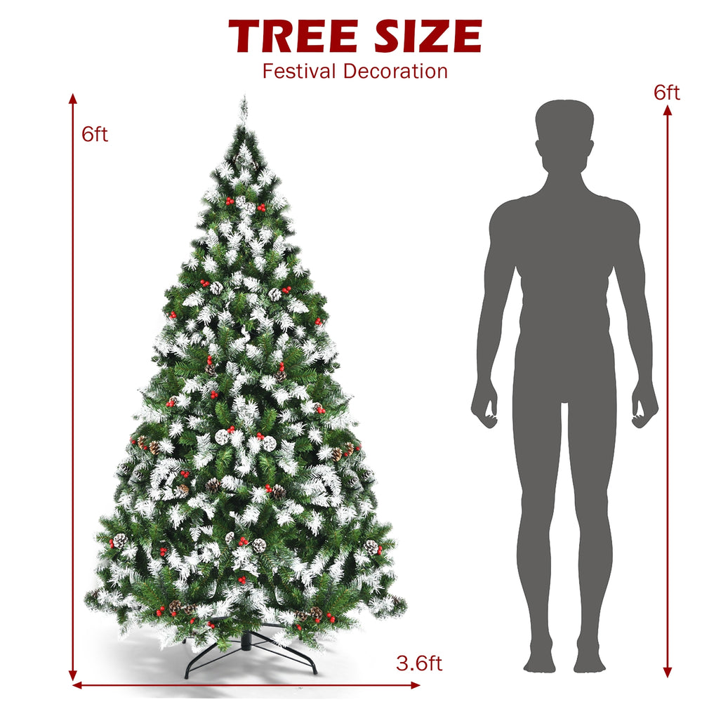 6ft pre-lit snow flocked Christmas tree with red berries and 250 LED lights, perfect for festive home decoration.