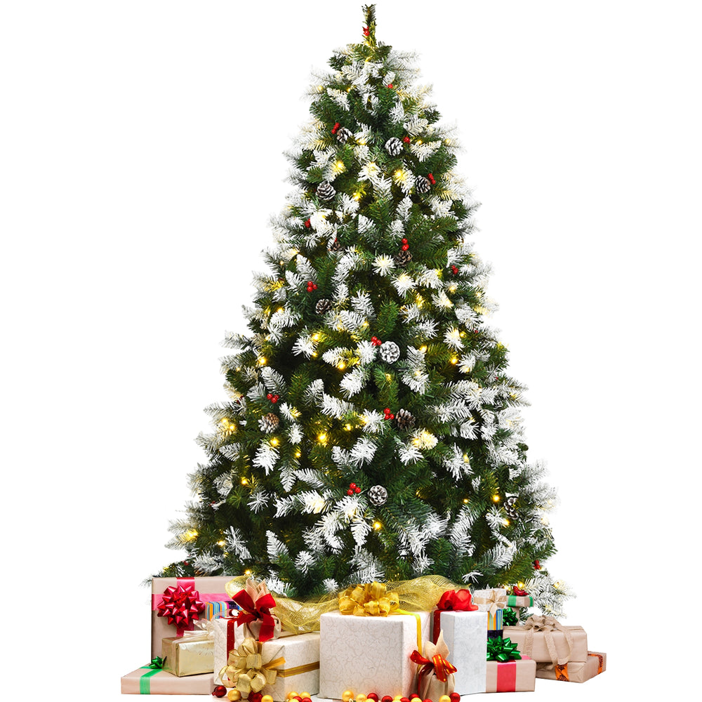 Pre-lit snow flocked Christmas tree with red berries, 6 ft tall, adorned with 250 LED lights and surrounded by wrapped.