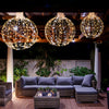 Three decorative LED light balls in golden hues, featuring warm and white lights, perfect for festive outdoor decor.