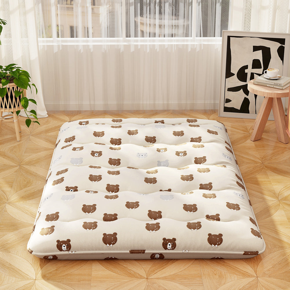 Foldable full-size futon mattress with bear print, polyester padded for comfort, ideal for camping and home use.