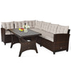 Sectional rattan outdoor sofa set with padded cushions and slatted dining table, perfect for patios and gardens.