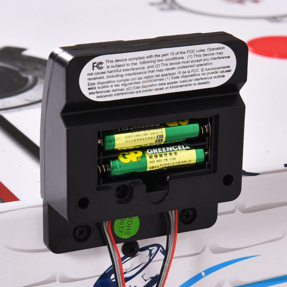Close-up of the battery compartment for the 42-inch air hockey table, requiring 2 AAA batteries for operation.