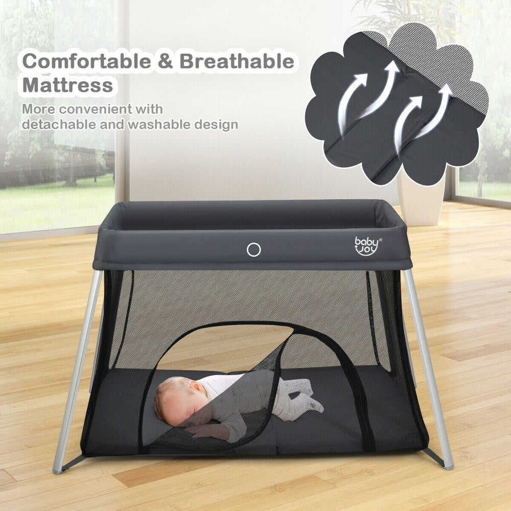 Lightweight foldable baby playpen in dark gray with breathable mesh, detachable mattress, and convenient zipper door.