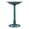Green pedestal bird bath feeder made of weather-resistant resin, featuring a decorative bowl and stable base for.