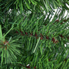Close-up of the green PVC branches of a 2 ft artificial Christmas tree with a burlap bag base for stability.
