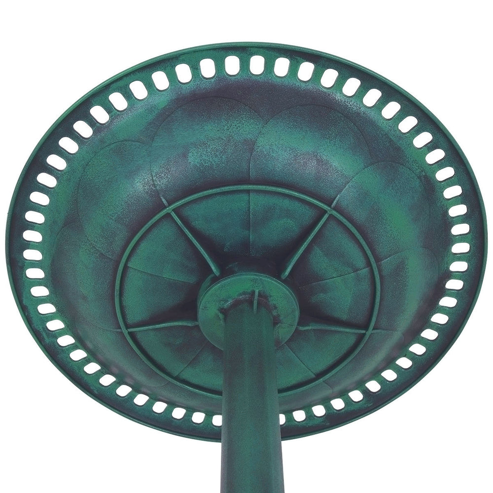 Underside view of the green pedestal bird bath feeder, made of weather-resistant resin with a copper verdigris effect.