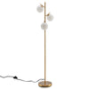 Three-globe floor lamp in gold with glass shades and foot switch, perfect for stylish corner lighting in any decor.