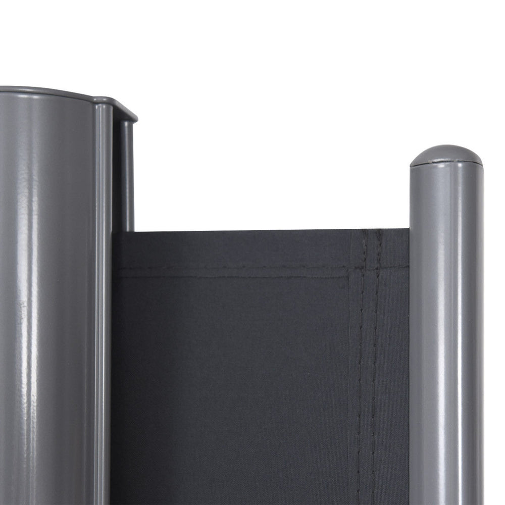 Detail view of the top edge of the 237 x 63 inch patio retractable double folding side awning screen divider in gray.