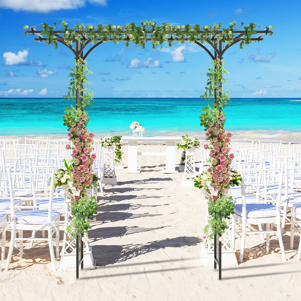 Garden arbor with trellises for climbing plants, adorned with flowers, perfect for weddings and outdoor events.