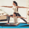 Folding exercise gym mat in black and turquoise, ideal for stretching and gymnastics, featuring a four-panel design.