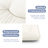 Quilted beige futon mattress with wrap-around construction for secure fit, ideal for camping or as a sleeping pad.