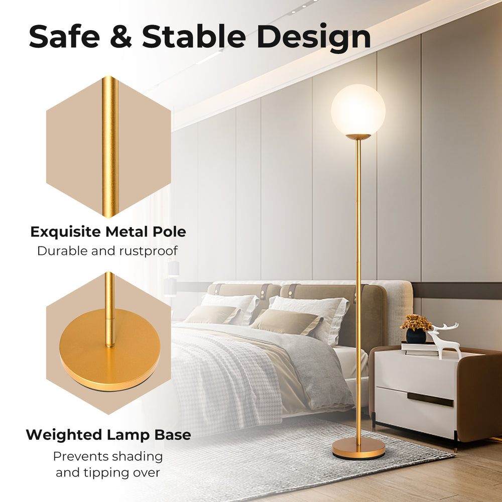 Glass globe LED floor lamp with a golden metal pole and weighted base, perfect for elegant home or office lighting.