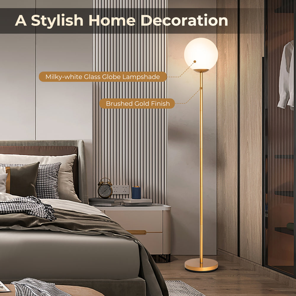 Glass globe LED floor lamp with brushed gold finish, featuring a milky-white glass lampshade for stylish home decor.