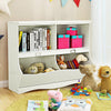 White kids storage unit featuring four divided shelves, perfect for organizing toys and books in a playful room setting.