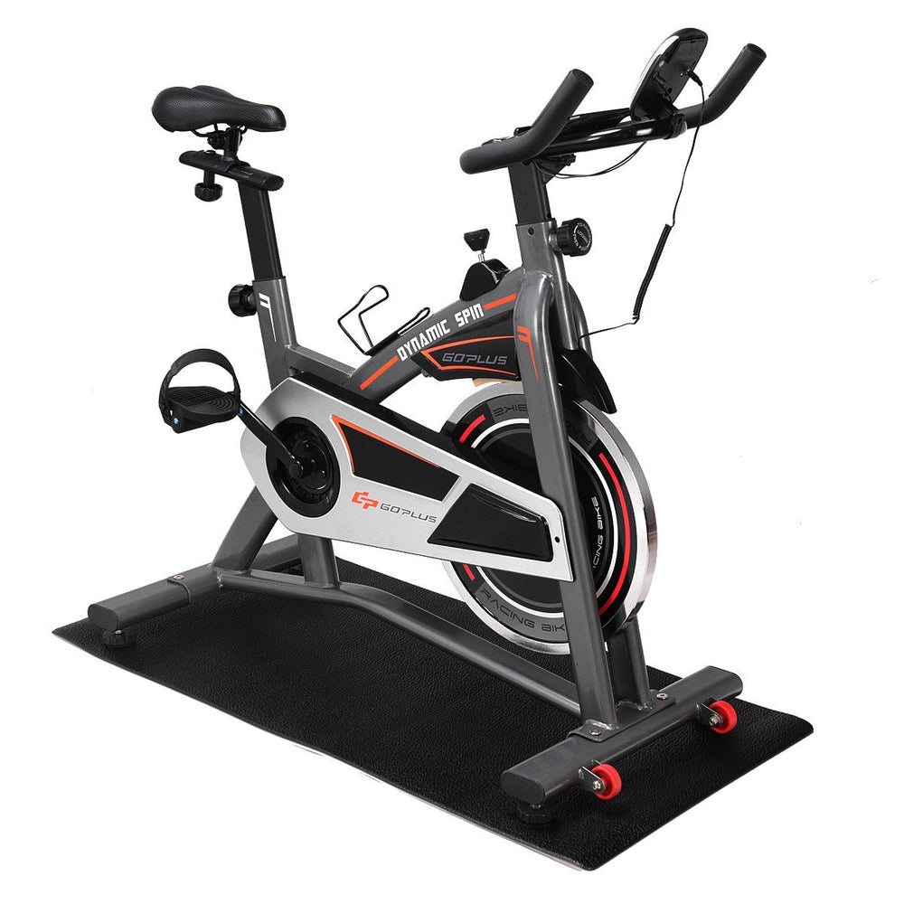Stationary exercise bike on a high-density PVC mat, ideal for home gym use, protects floors and reduces noise.