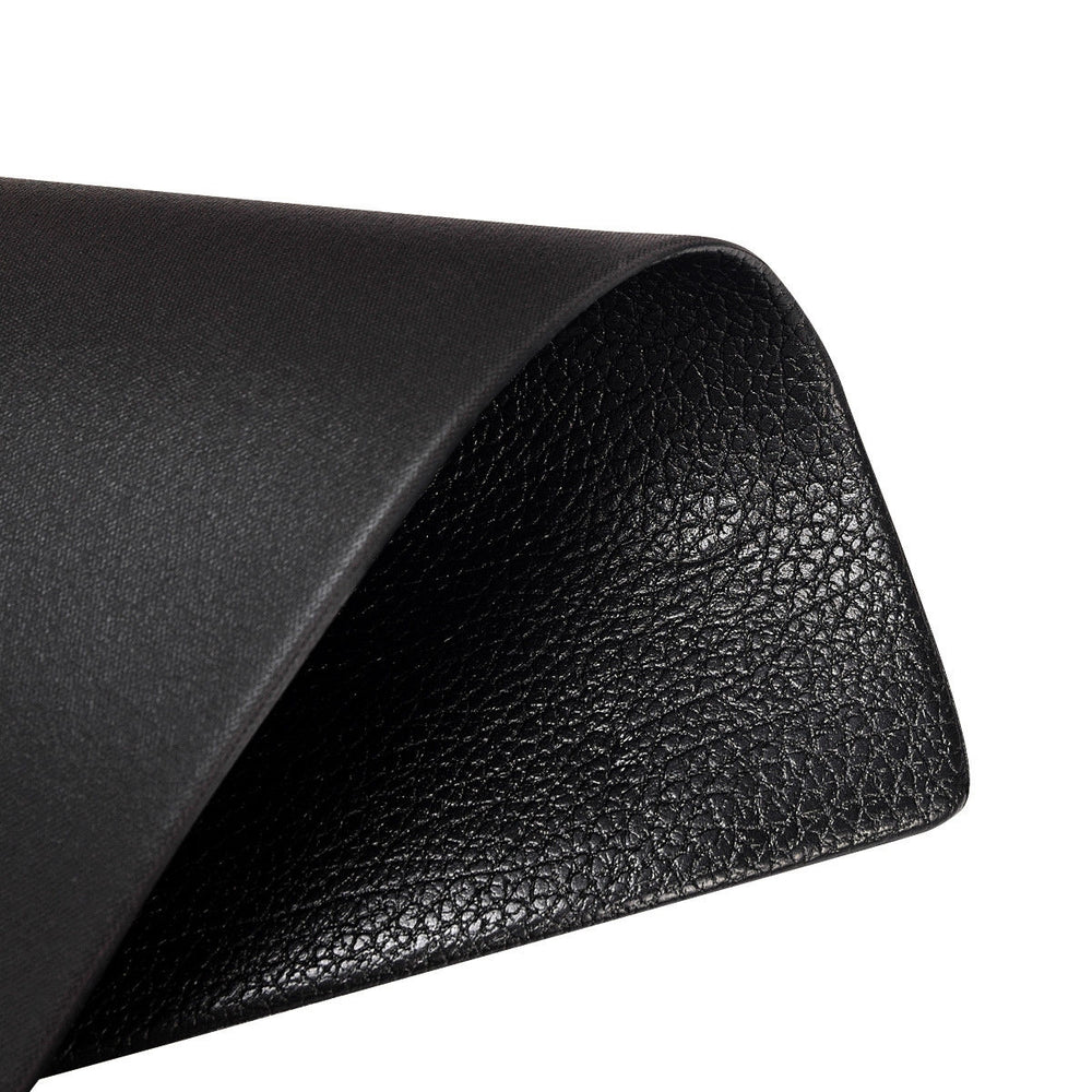 Textured black PVC mat showcasing its surface detail, ideal for gym equipment use and floor protection.