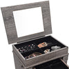 Jewelry cabinet organizer in gray with top mirror, five drawers, and side doors for ample storage and elegant display.