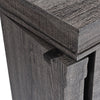 Close-up of the gray standing jewelry cabinet showing the top edge and magnetic door catch for easy closing.