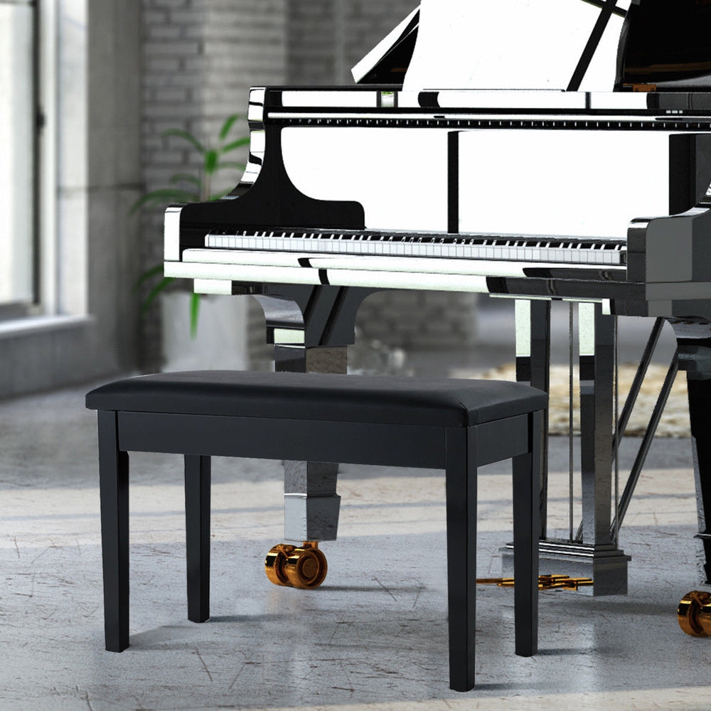Black solid wood piano bench with PU leather padding and storage compartment, ideal for music settings.