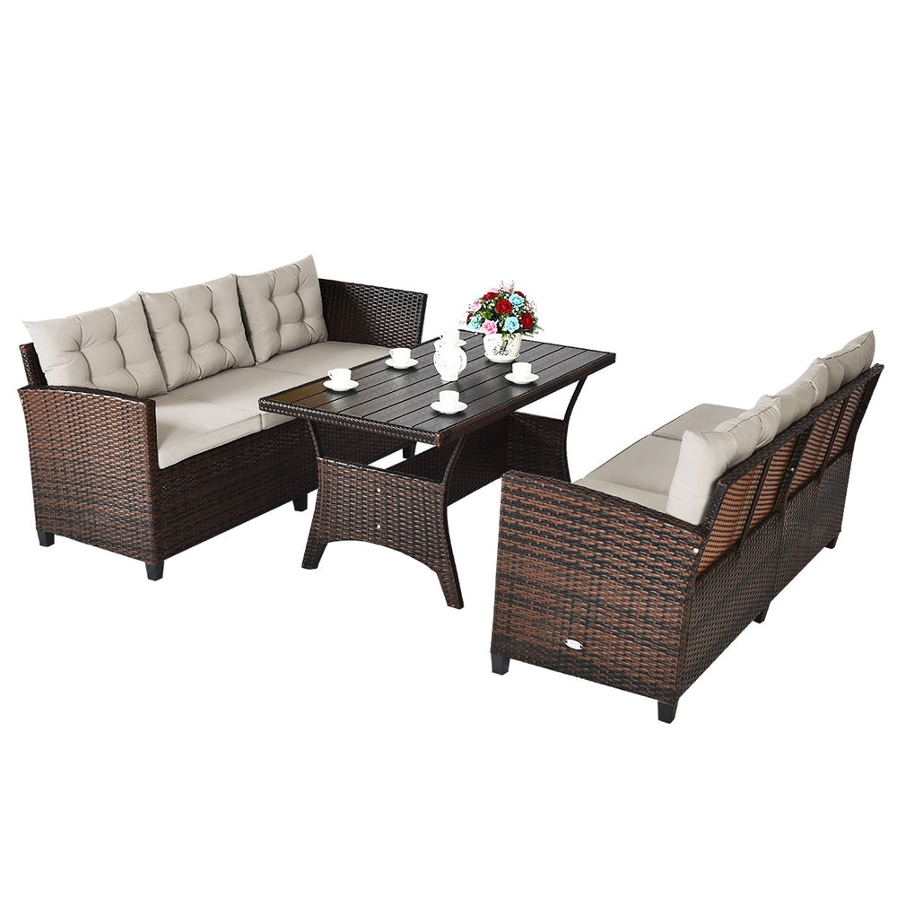 3-piece hand-woven rattan outdoor sofa set with cushions and dining table, perfect for garden or patio relaxation.
