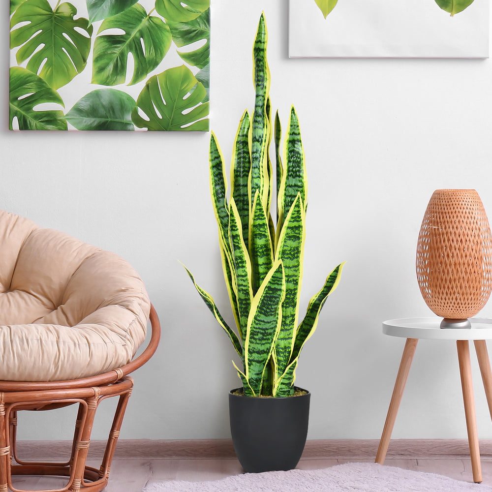 Artificial snake plant with slender, strong leaves and bright yellow edges, ideal for adding a touch of nature indoors.