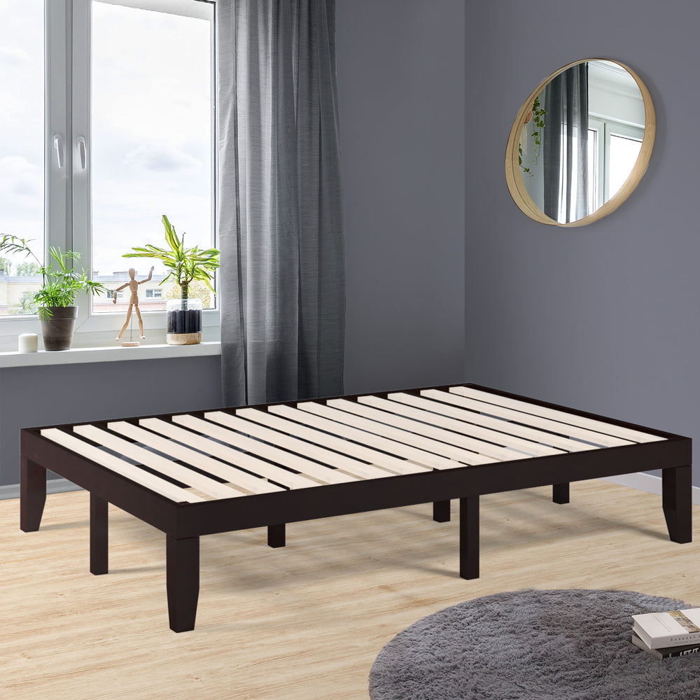 Brown 14-inch full-size wood platform bed frame with slat support, featuring a modern design and large under-bed.