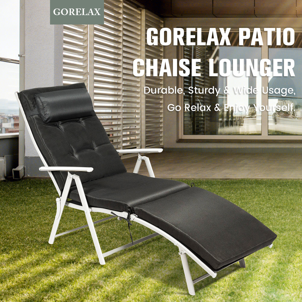 Adjustable black folding chaise lounge chair with removable pillow, sturdy steel frame, perfect for outdoor relaxation.