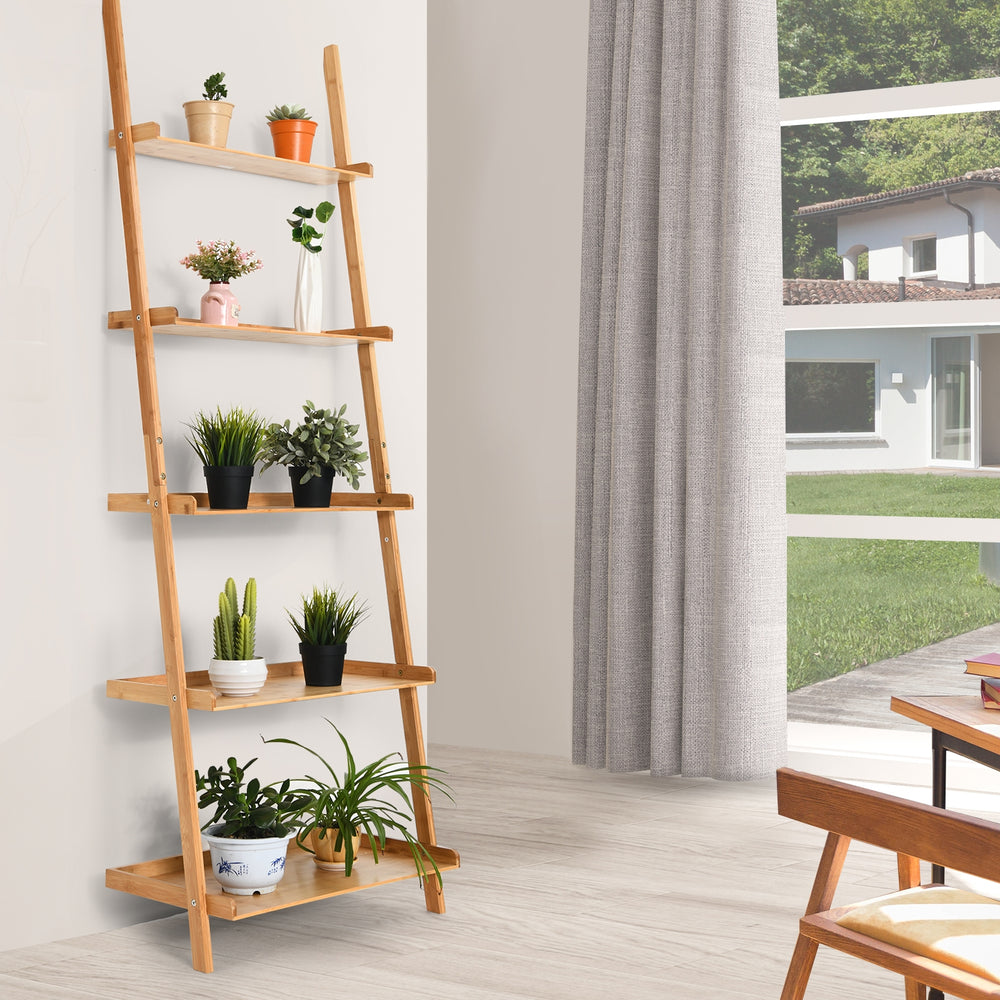 5-tier bamboo ladder shelf with wall-leaning design, perfect for plants and storage in living room or kitchen.