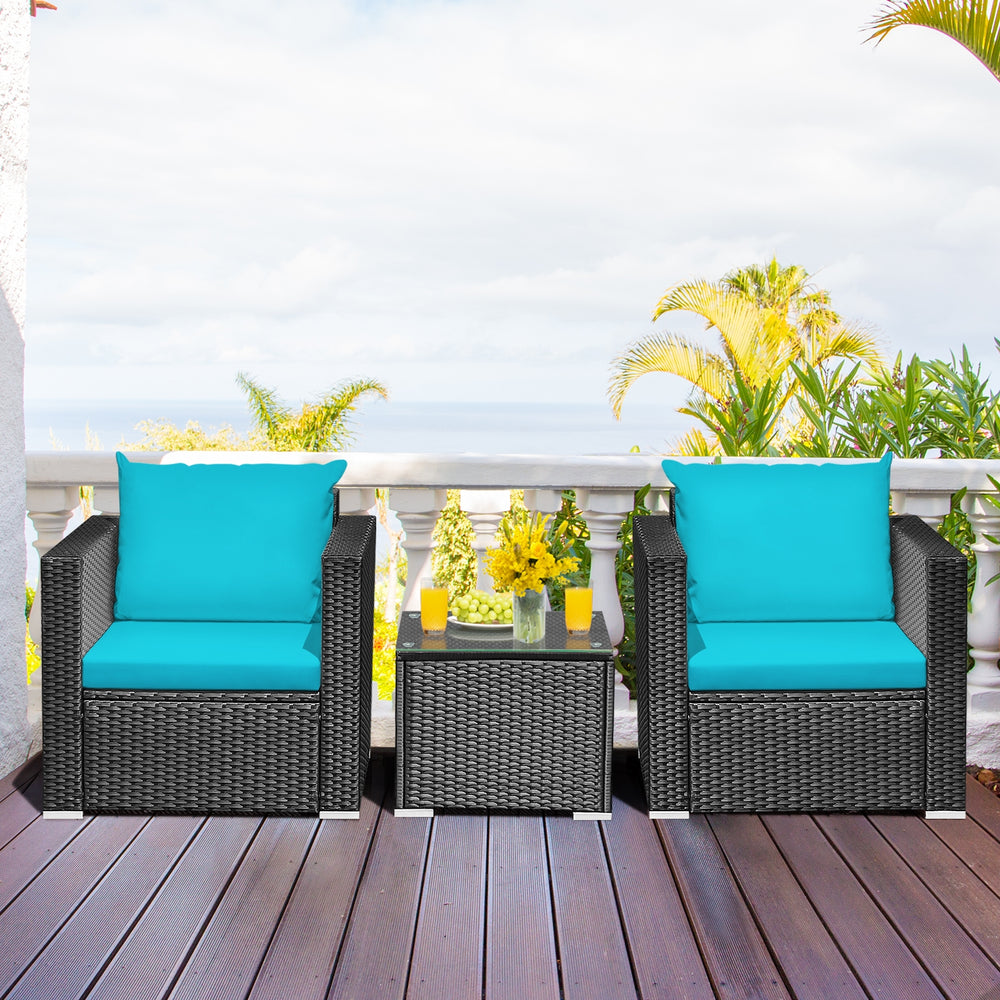 Turquoise cushion patio wicker conversation set with a glass top table, perfect for outdoor relaxation in gardens or.